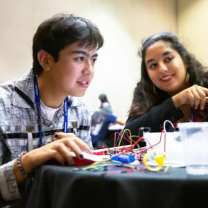 Two people working together