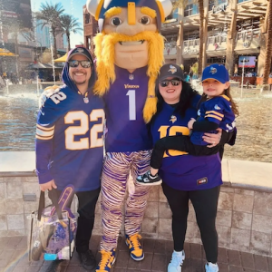 Dina at a football game with her family.