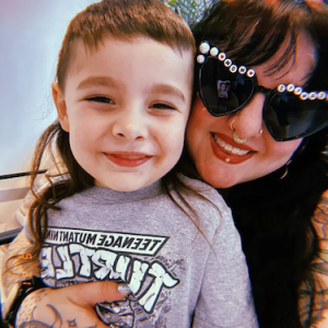 Dina with her child.