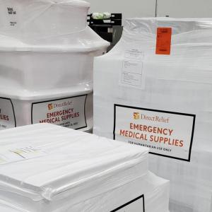 Stacks of wrapped pallets, "DirectRelief Emergency Medical Supplies" on the sides