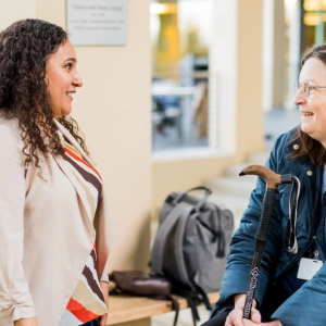several people smiling and talking
