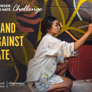 Banner with image of muralist painting and the words, "Stand Against Hate"