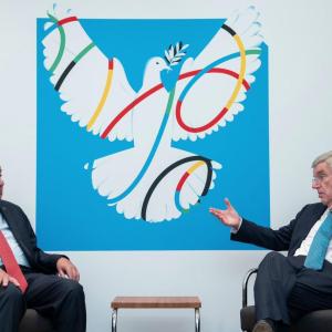 Two people sat opposite each other having a discussion 