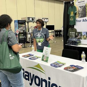 Ebony talking to a student at the SAF Conference