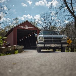 Car driving under covered bridge