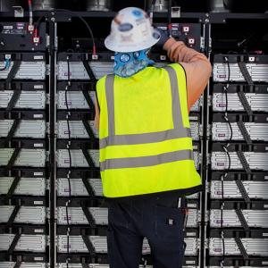 person working on electrical equipment