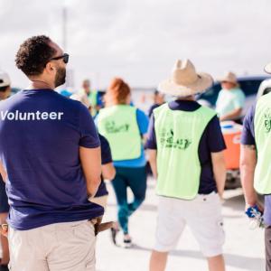 A group of volunteers walking away from the camera
