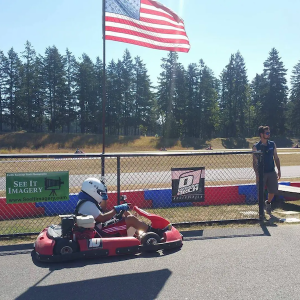 Dwayne driving an F1 gocart.