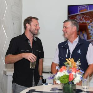 Two people at Homeruns & Highballs fundraiser