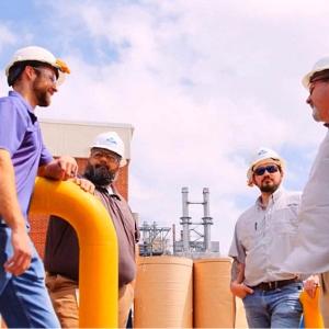 Four factory workers talk