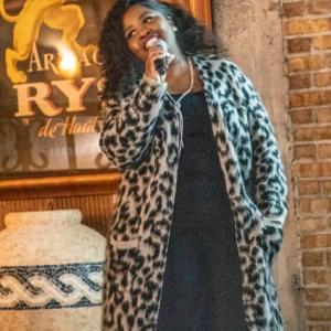 smiling person with Mic