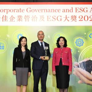 Three people stood together at the annual Best Corporate Governance and ESG Awards