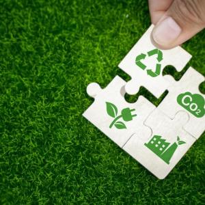 puzzle pieces representing ESG and sustainability - recycling reducing emissions