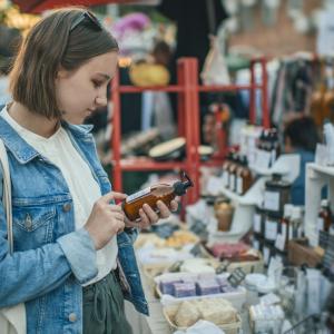 Woman Reading Label on Product