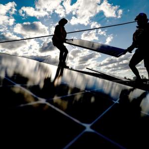 People installing solar panels