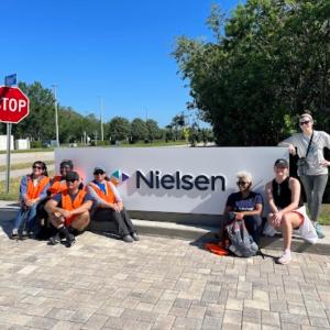 Nielsen Team Members in front of the corporate headquarters.