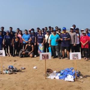 Nielsen volunteers cleaning a beach.