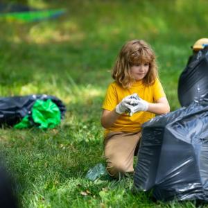 Child picking up litter