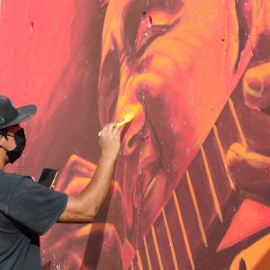 Person painting mural