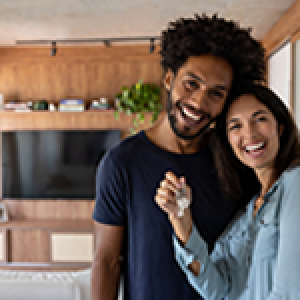 Smiling couple with keys