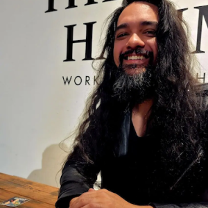 Elika seated at a table.