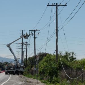 Professional working on an overhead power line