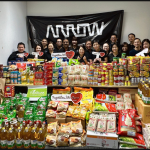 Arrow employees helping at a food bank in Singapore