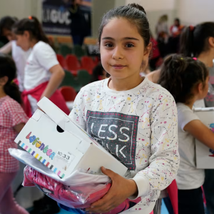 Student with shoe box