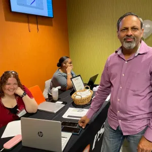 people talking in front of a PSEG table