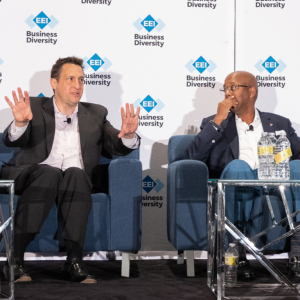 Two people talking on stage