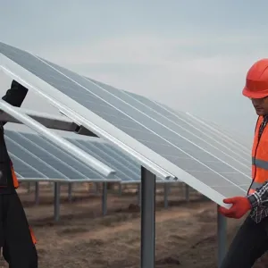 2 people install a solar panel