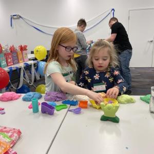 Two children participating in science experiments and activities