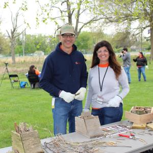 two people smiling together outside