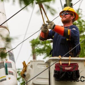 Entergy employee fixing power lines 