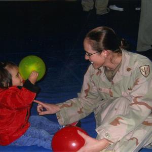 Erica Choi shown playing with a young girl.