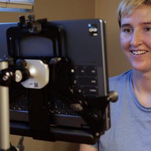 Erin Taylor looking at an electronic device