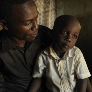 Ernest's son sits in his lap