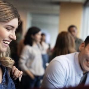 Two Essity employees shown having a conversation.
