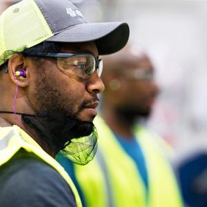 Male Essity employee wearing safety gear.