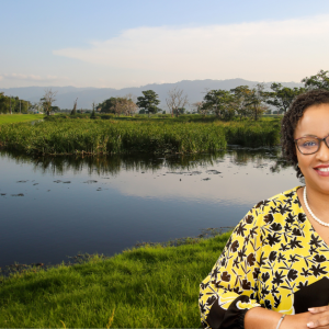 Headshot of Esther Hackett against a water and trees backdrop