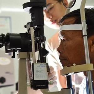 Doctor examining patient's eyes