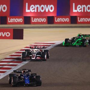 A F1 race. Lenovo banners on the boundaries.