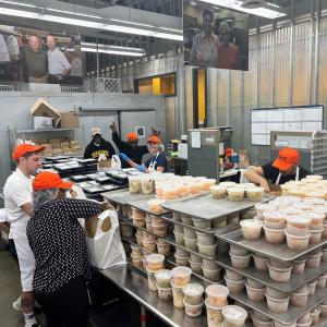 SAIC employees in the Washington, DC area put together meal packages at the Capital Area Food Bank on Sept. 16, 2022.