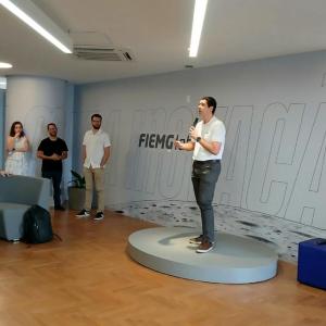 Person standing on a podium to address a group