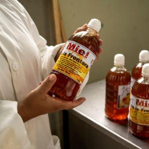 Honey bottles are finalized and packaged. 