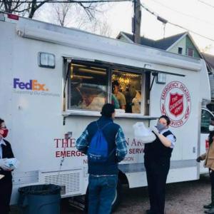 people waiting near food truck