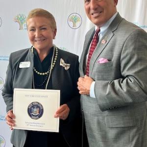 Lydia Biskup (left), Chief of Staff of New York State Senator Rob Rolison’s office, presents KeyBank’s Hudson Valley/Metro NY President John Manginelli with a proclamation from the senator’s office.