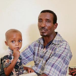 Gebremedihin and his son at the Action Against Hunger-supported clinic