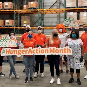 Equality Alliance members help out at a local food bank during Feeding America's Hunger Action Month.