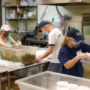  people working in a kitchen